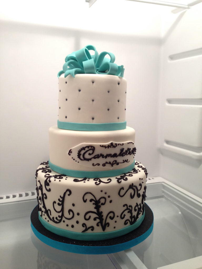 3 tier teal, white, and black cake